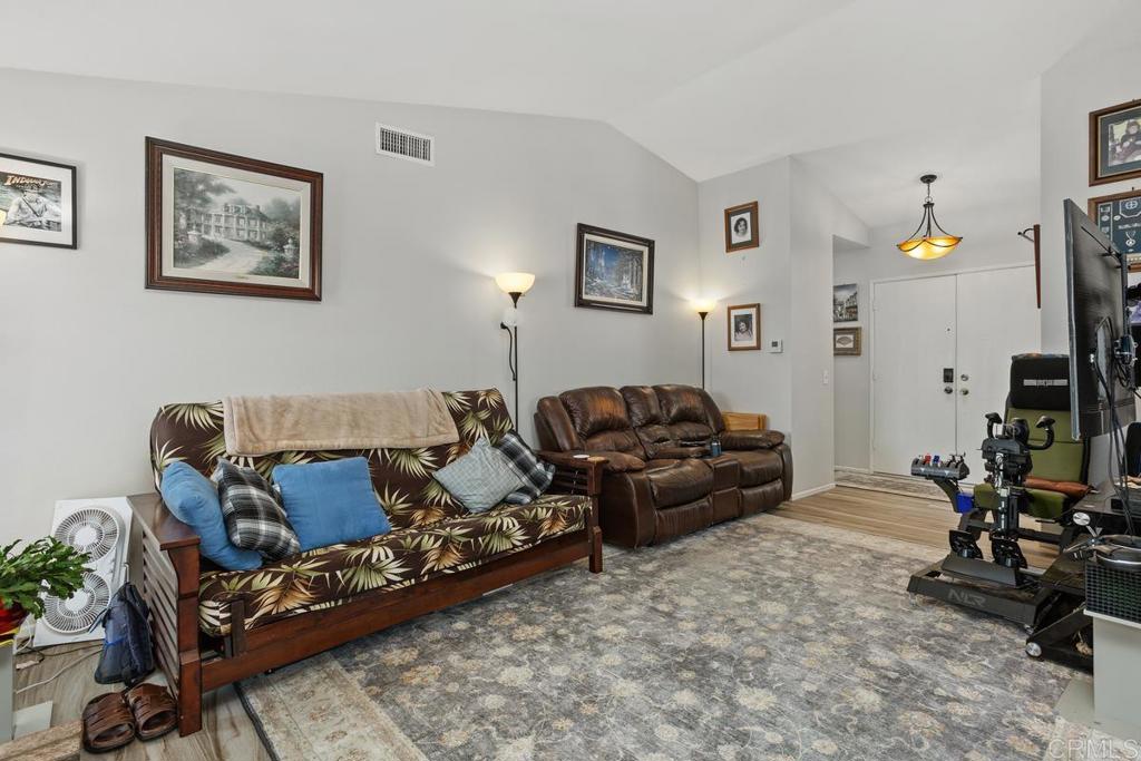 4616 Arrowhead Court Oceanside, CA 92056 - Photo 12 of 50 a living room with furniture and a flat screen tv