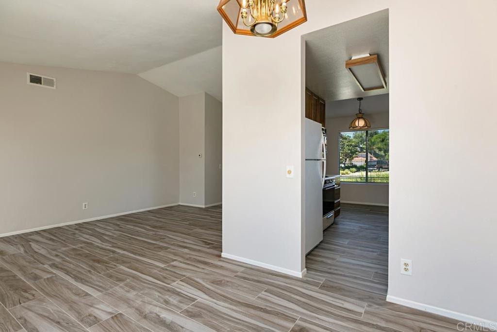 4616 Arrowhead Court Oceanside, CA 92056 - Photo 15 of 50 a view of a hallway with wooden floor and entryway