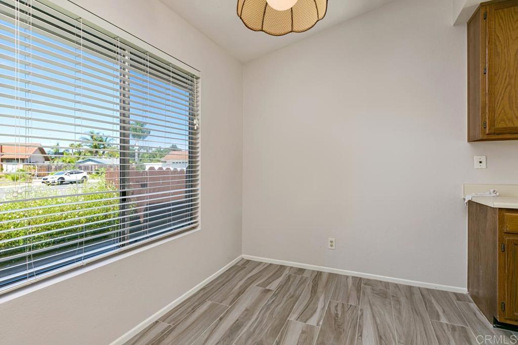 4616 Arrowhead Court Oceanside, CA 92056 - Photo 22 of 50 a view of a room that has a window and wooden floor