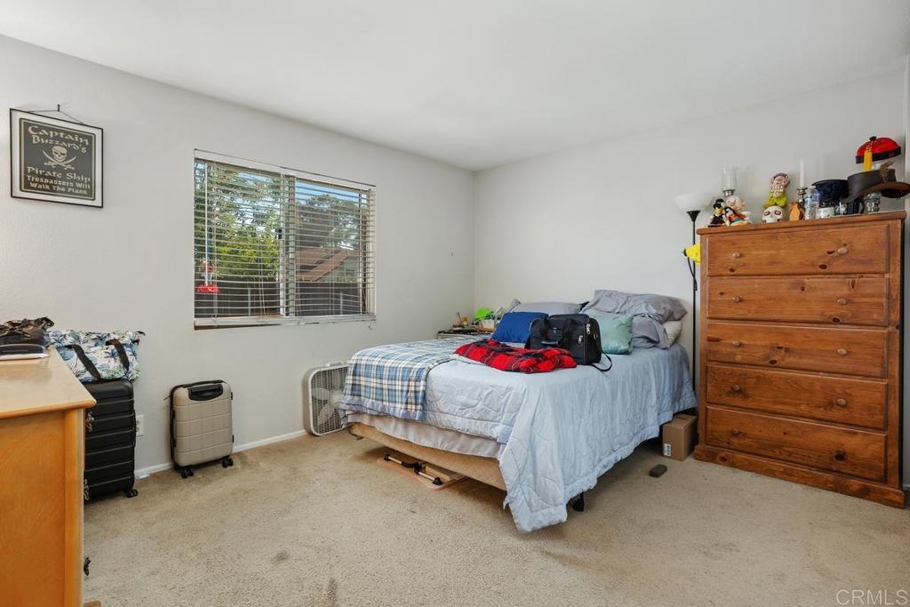 4616 Arrowhead Court Oceanside, CA 92056 - Photo 27 of 50 a bedroom with a bed and a dresser