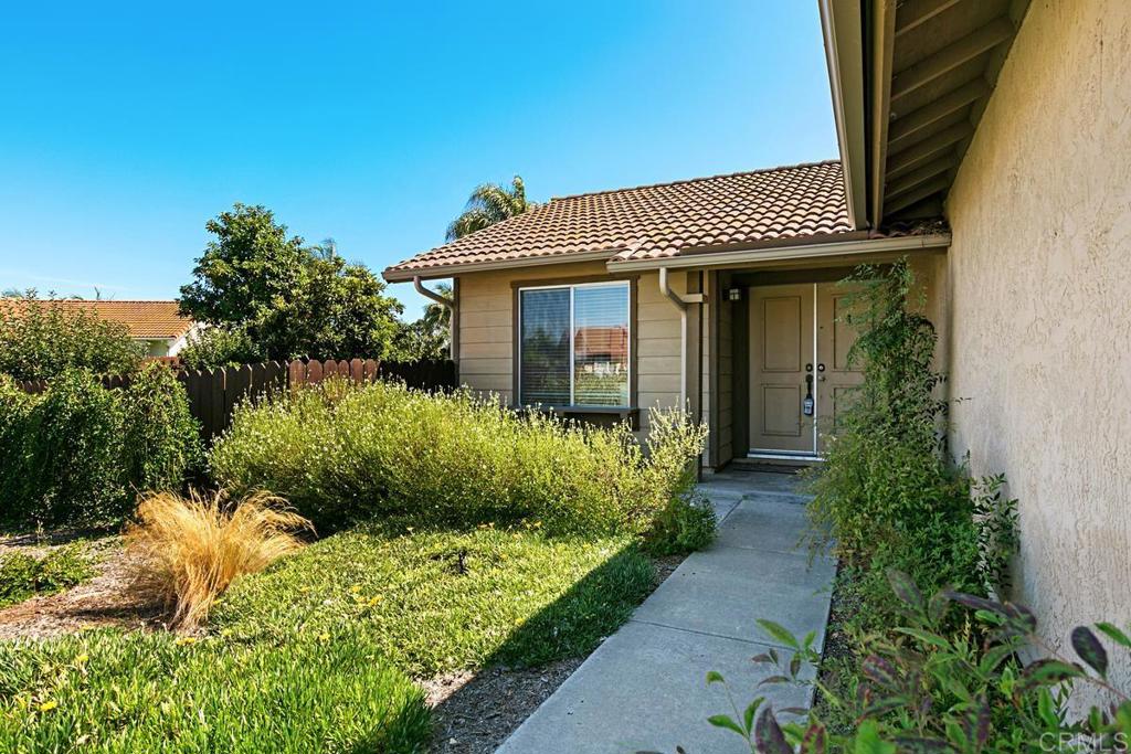 4616 Arrowhead Court Oceanside, CA 92056 - Photo 3 of 50 a view of a house with a yard and plants