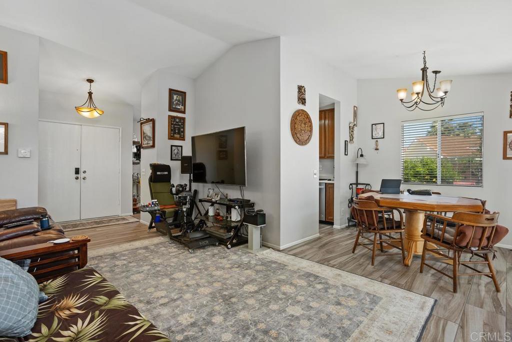 4616 Arrowhead Court Oceanside, CA 92056 - Photo 10 of 50 a bedroom with furniture and a flat screen tv