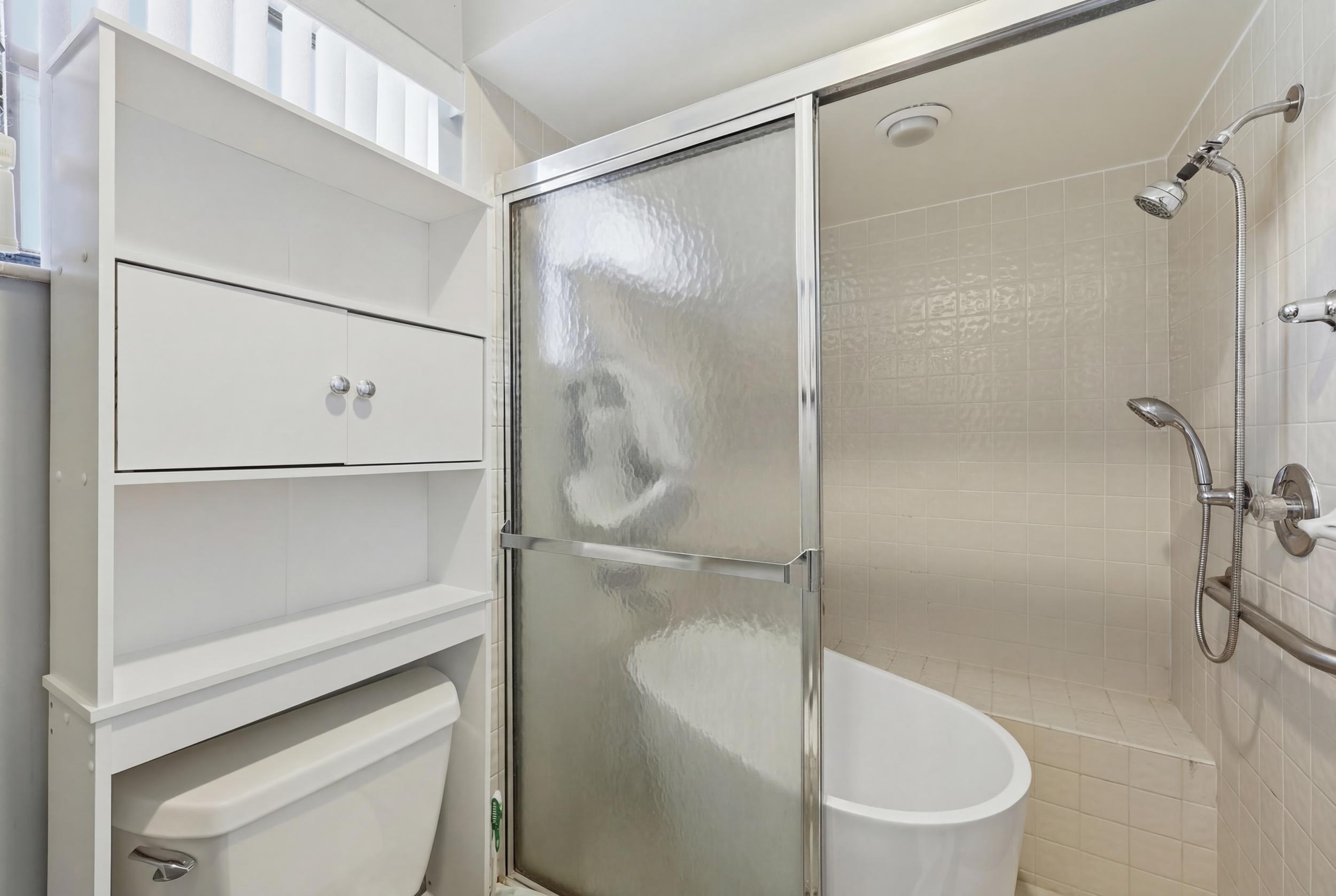 10768 Waterberry Drive Boca Raton, FL 33498 - Photo 13 of 26 a bathroom with a shower and a toilet