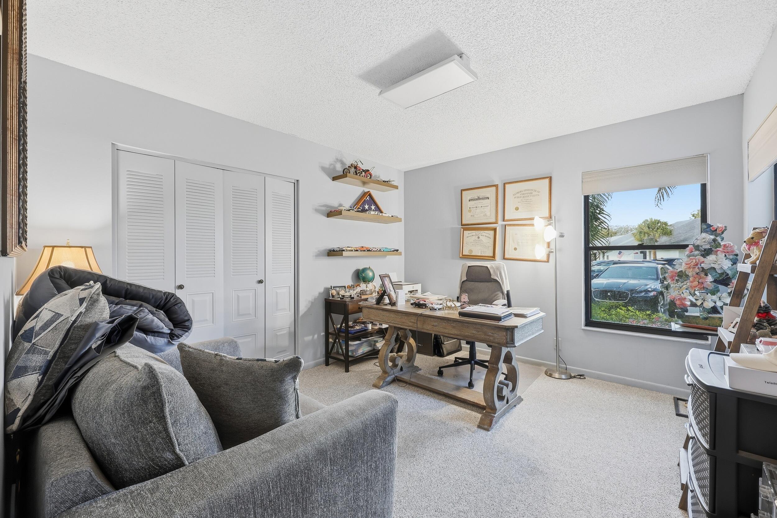 10768 Waterberry Drive Boca Raton, FL 33498 - Photo 14 of 26 a living room with furniture and a window