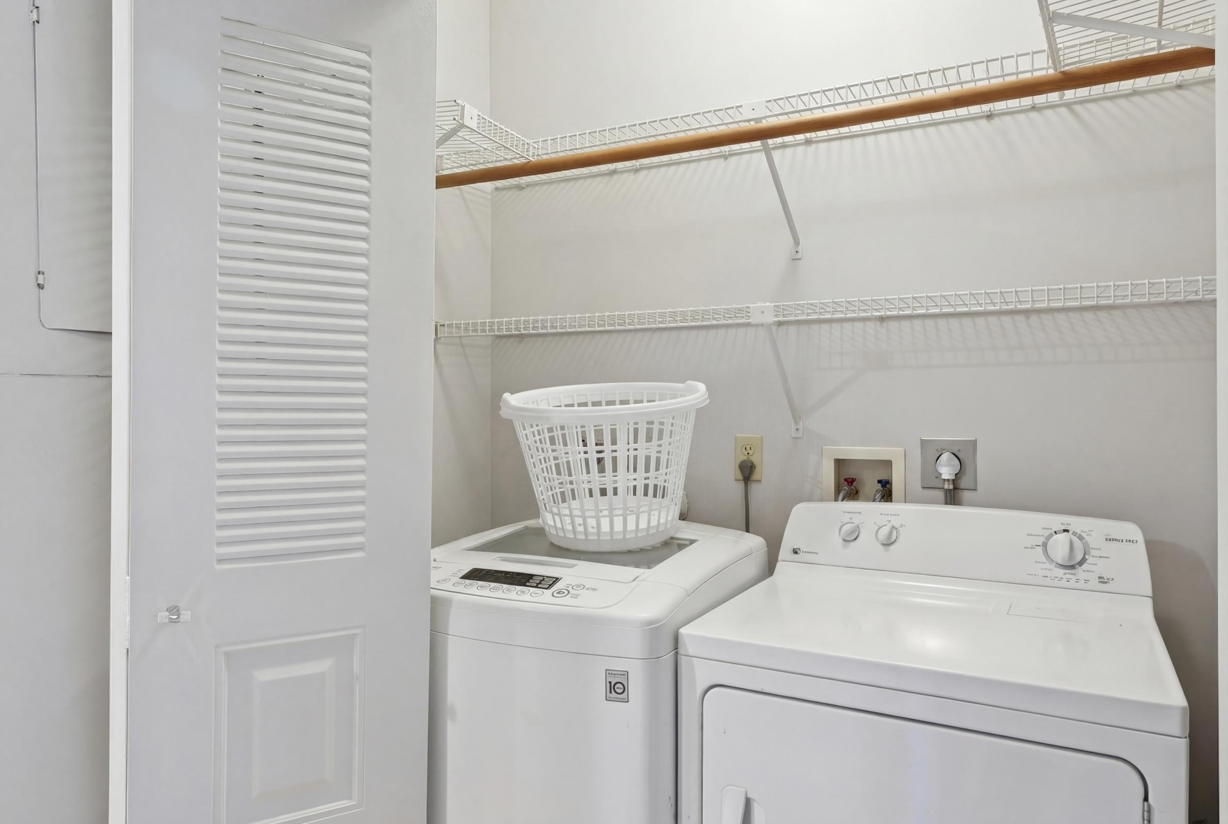 10768 Waterberry Drive Boca Raton, FL 33498 - Photo 17 of 26 a utility room with dryer and washer