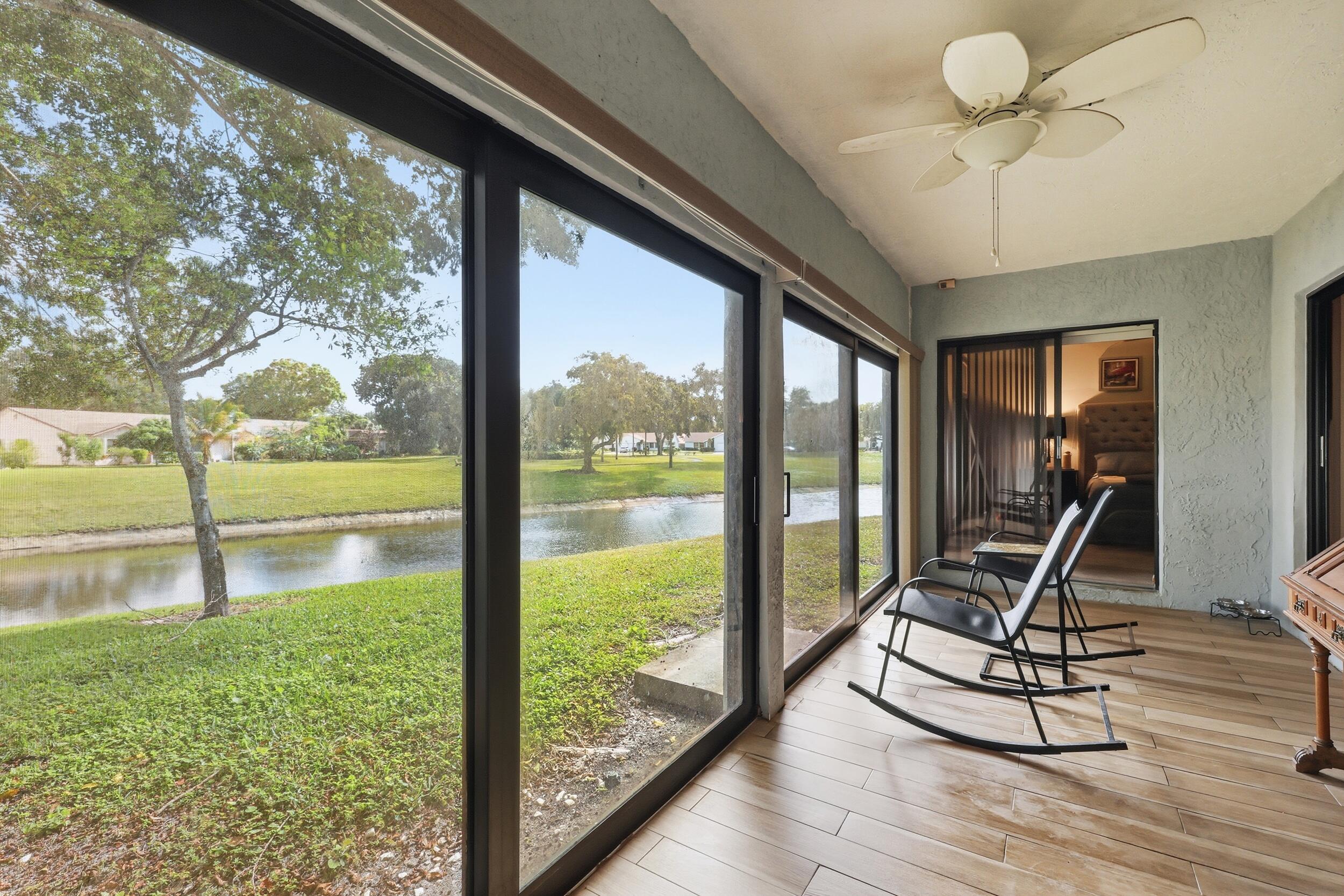 10768 Waterberry Drive Boca Raton, FL 33498 - Photo 18 of 26 a view of a room with a floor to ceiling window and an entryway