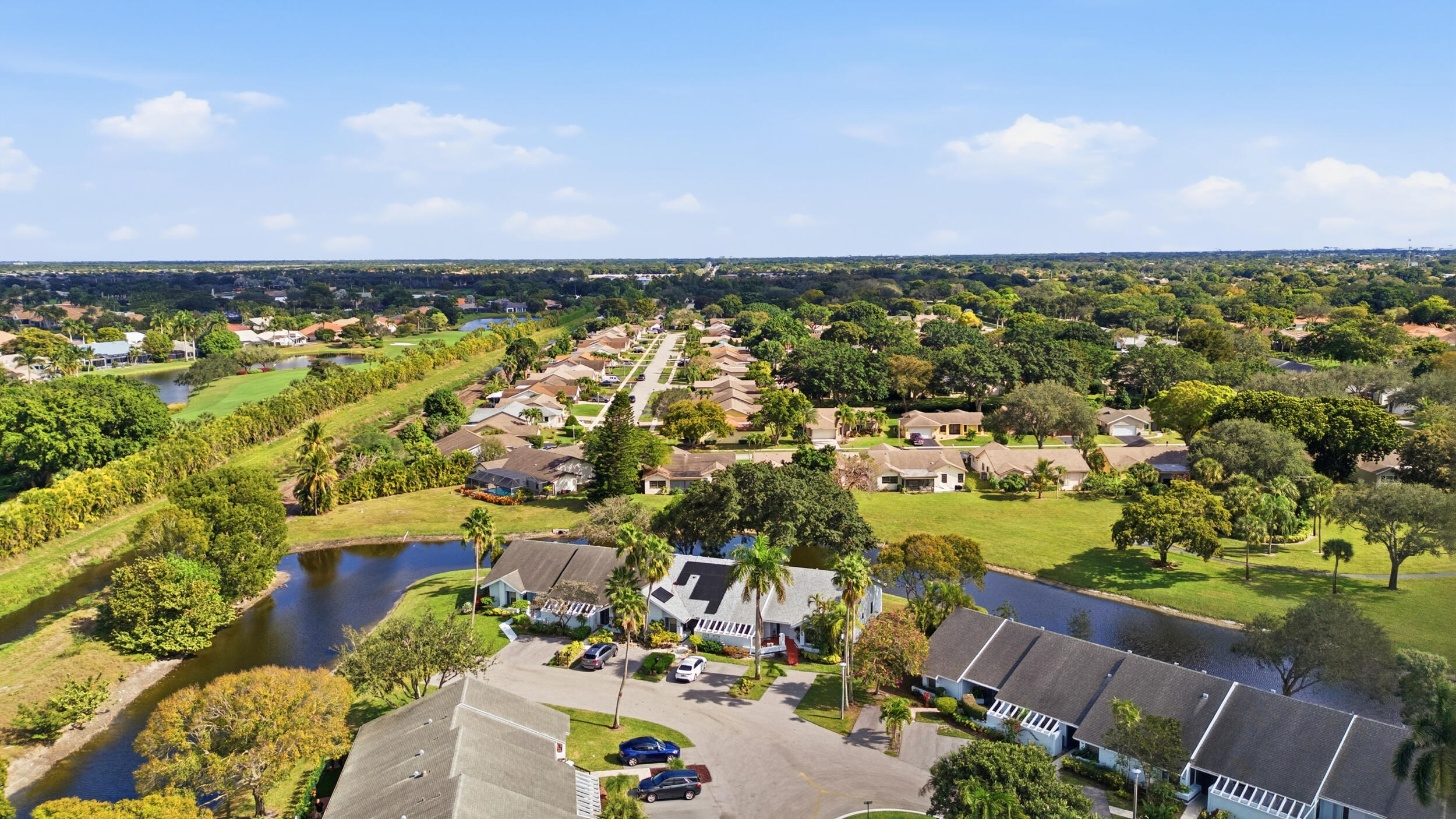 10768 Waterberry Drive Boca Raton, FL 33498 - Photo 21 of 26 an aerial view of a houses with a lake view