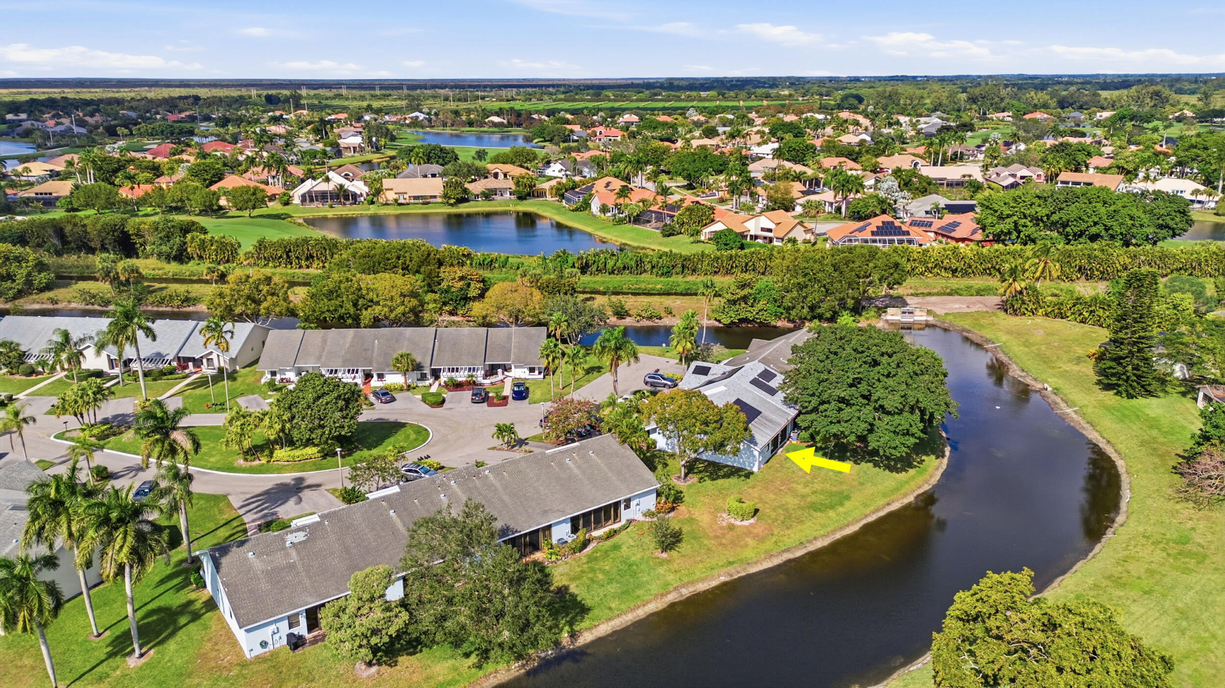 10768 Waterberry Drive Boca Raton, FL 33498 - Photo 22 of 26 an aerial view of a house with a lake view