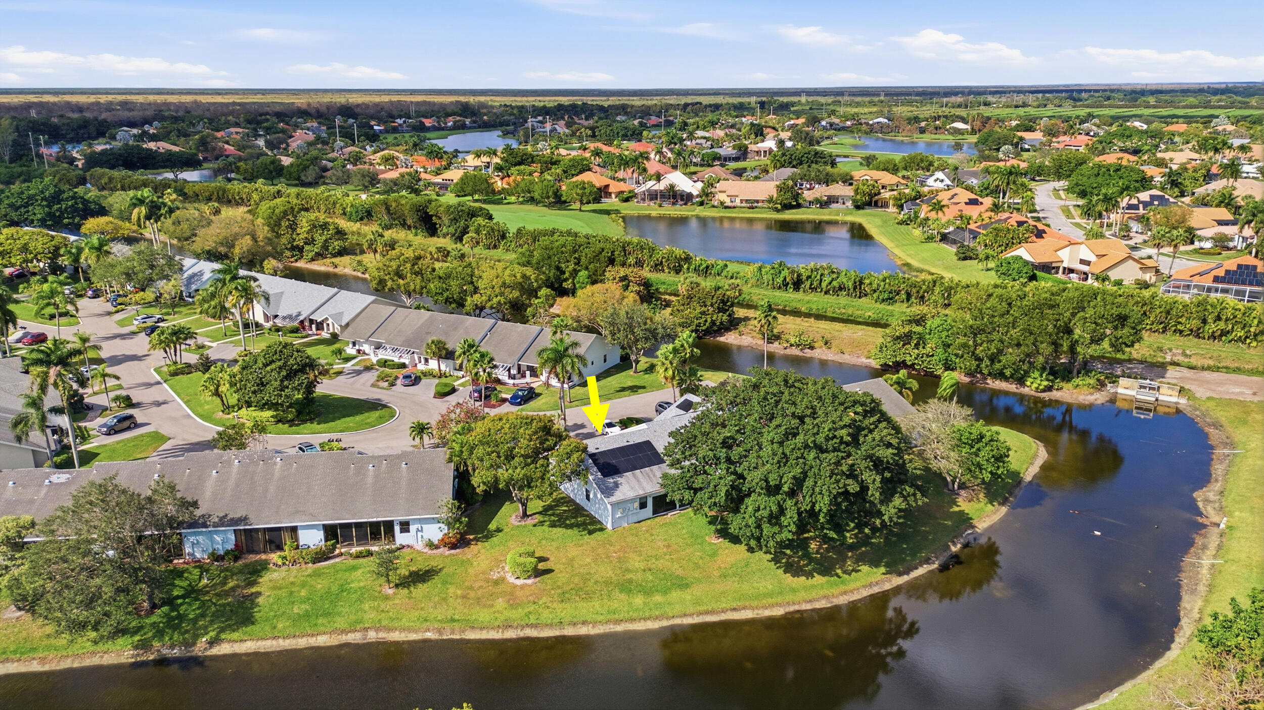 10768 Waterberry Drive Boca Raton, FL 33498 - Photo 23 of 26 an aerial view of residential houses with outdoor space and trees