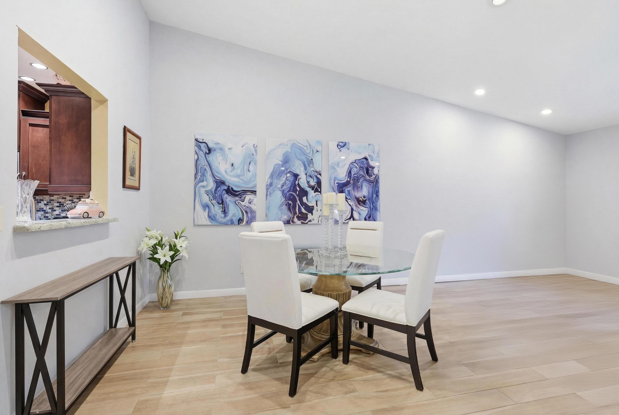 10768 Waterberry Drive Boca Raton, FL 33498 - Photo 3 of 26 a view of a dining room with furniture