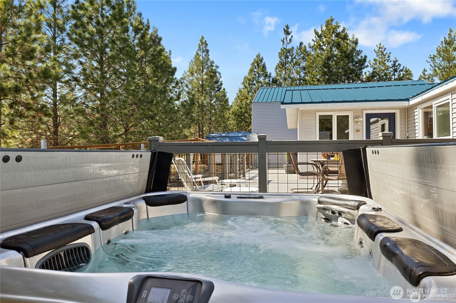 250 Danko Road Cle Elum, WA 98922 - Photo 15 of 38 a view of a patio with couches table and chairs with wooden floor and fence
