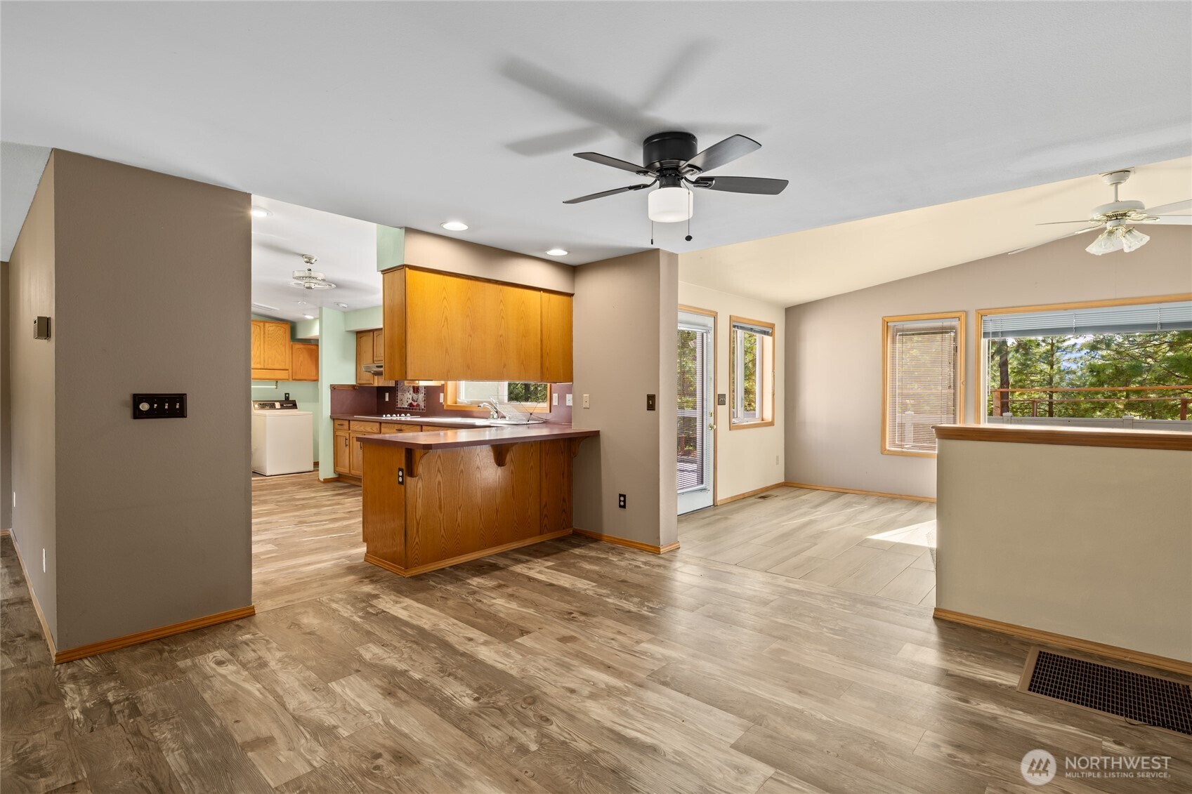 250 Danko Road Cle Elum, WA 98922 - Photo 23 of 38 a view of a kitchen with a refrigerator cabinets and a wooden floor