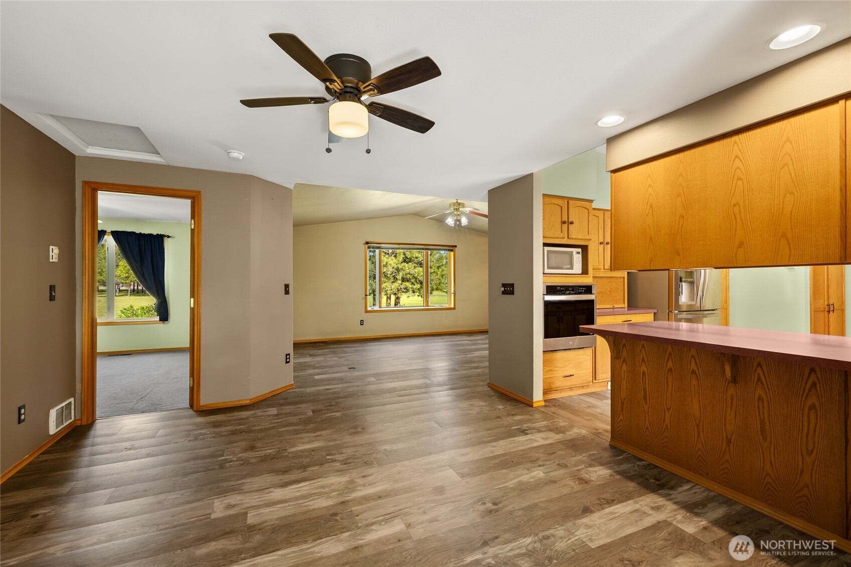 250 Danko Road Cle Elum, WA 98922 - Photo 26 of 38 a view of a kitchen with a sink cabinet a ceiling fan and wooden floor