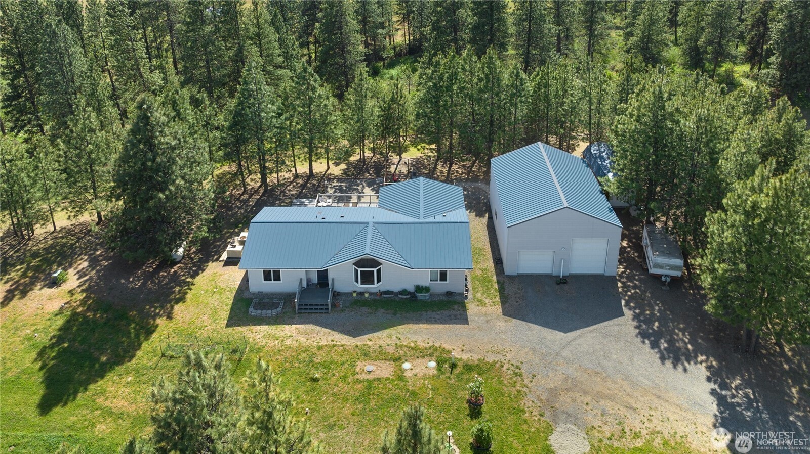 250 Danko Road Cle Elum, WA 98922 - Photo 5 of 38 an aerial view of a house with swimming pool and sitting area