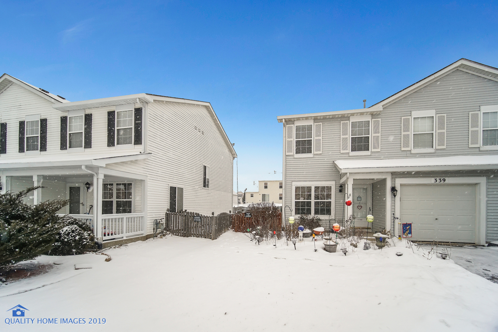 339 Reston Circle Romeoville, IL 60446 - Photo 2 of 26 a front view of a house with a yard
