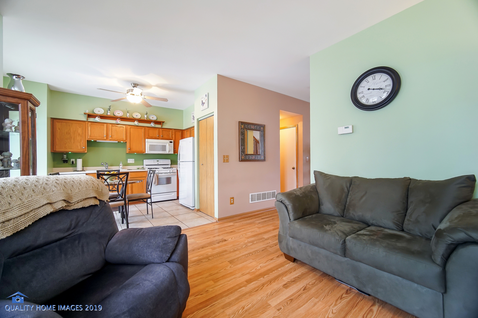 339 Reston Circle Romeoville, IL 60446 - Photo 11 of 26 a living room with furniture and a large window