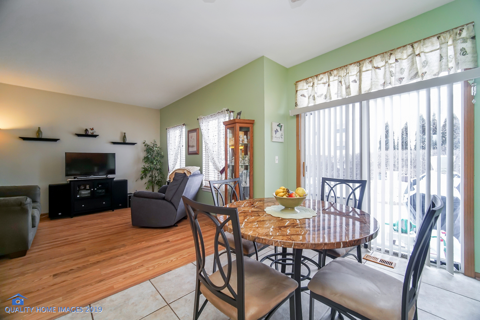 339 Reston Circle Romeoville, IL 60446 - Photo 14 of 26 a view of a dining room with furniture window and outside view