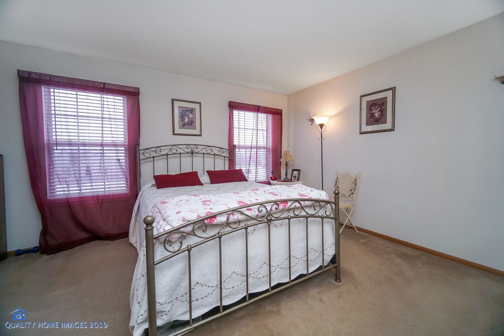 339 Reston Circle Romeoville, IL 60446 - Photo 17 of 26 a bedroom with a bed next to a window
