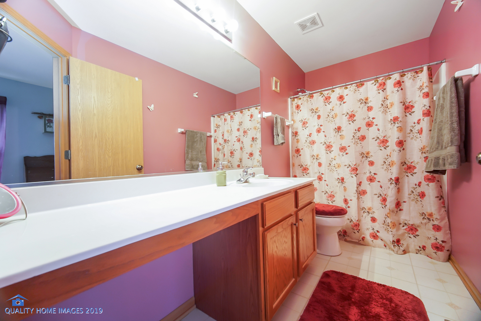 339 Reston Circle Romeoville, IL 60446 - Photo 19 of 26 a spacious bathroom with a sink mirror vanity and toilet
