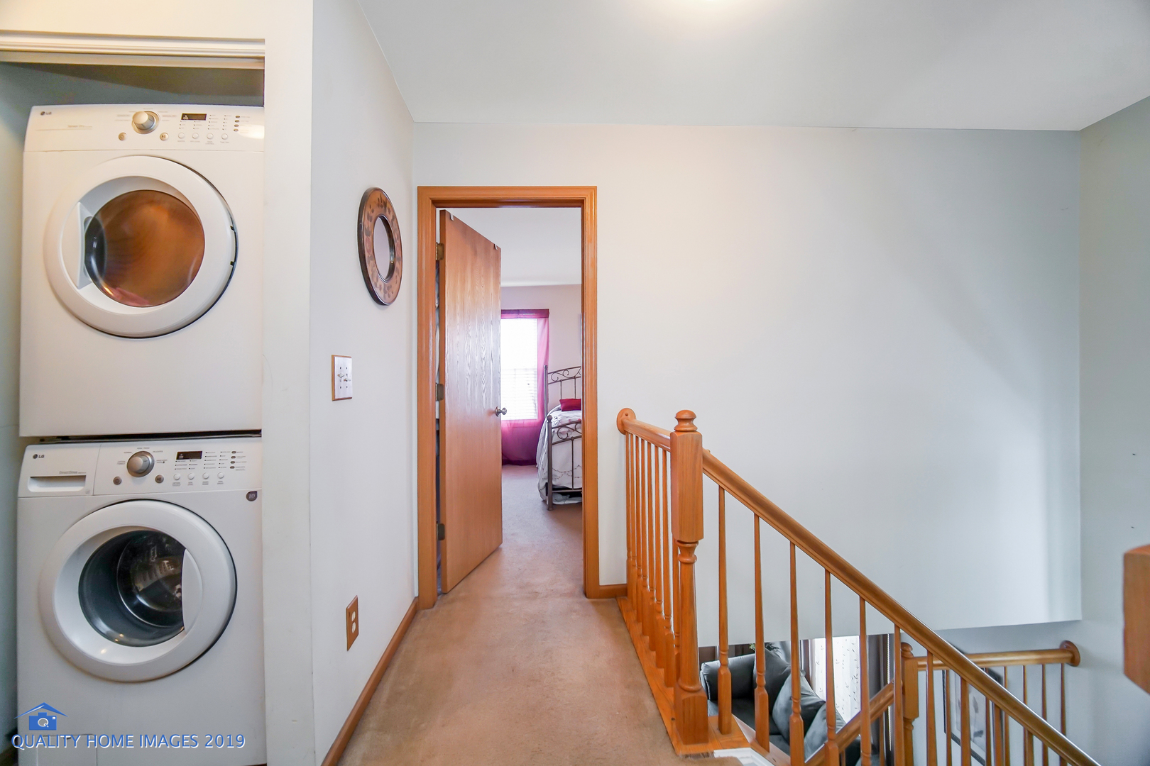 339 Reston Circle Romeoville, IL 60446 - Photo 22 of 26 a view of a hallway with washer and dryer