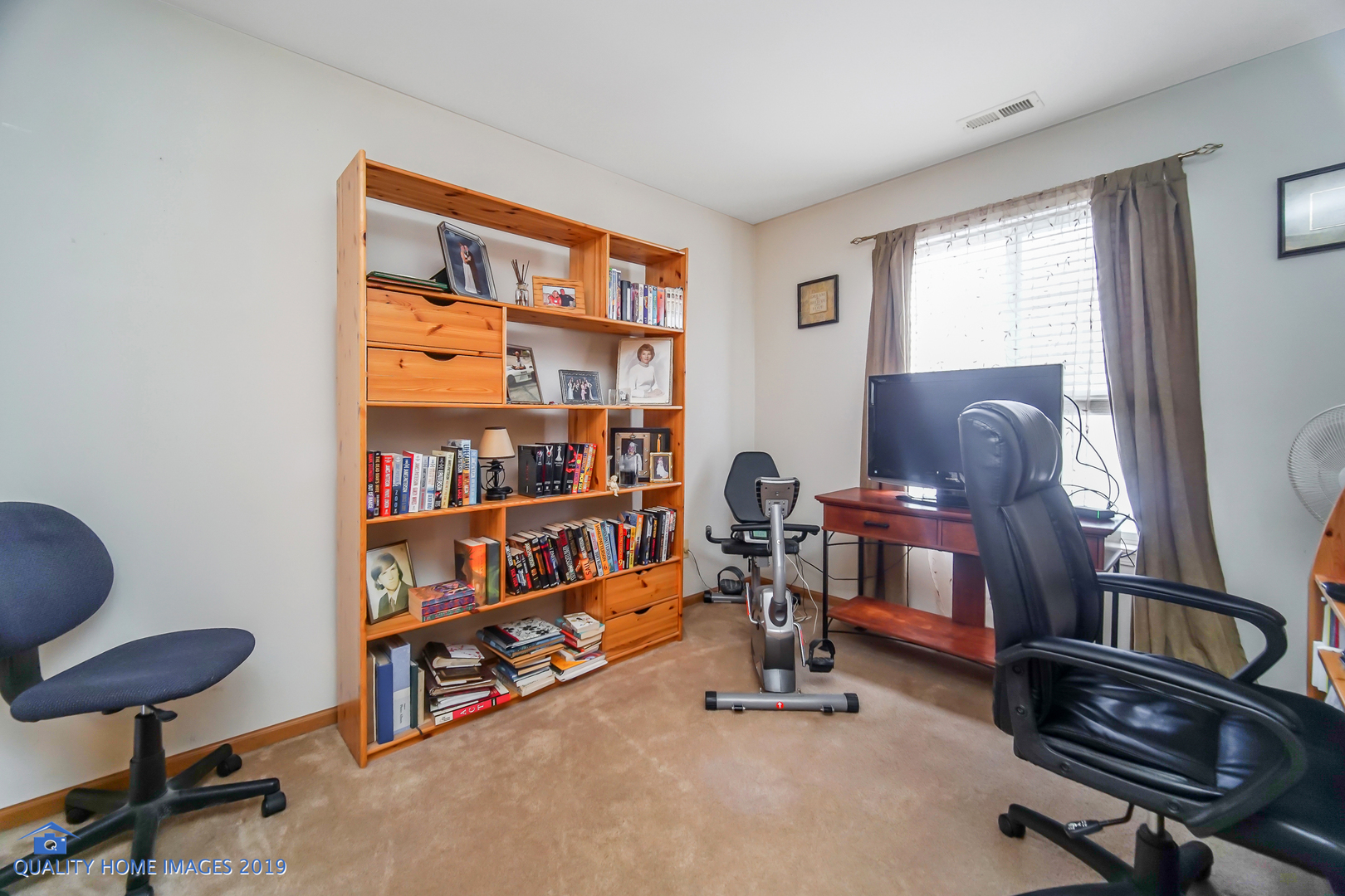 339 Reston Circle Romeoville, IL 60446 - Photo 23 of 26 a view of a workspace with furniture and a window