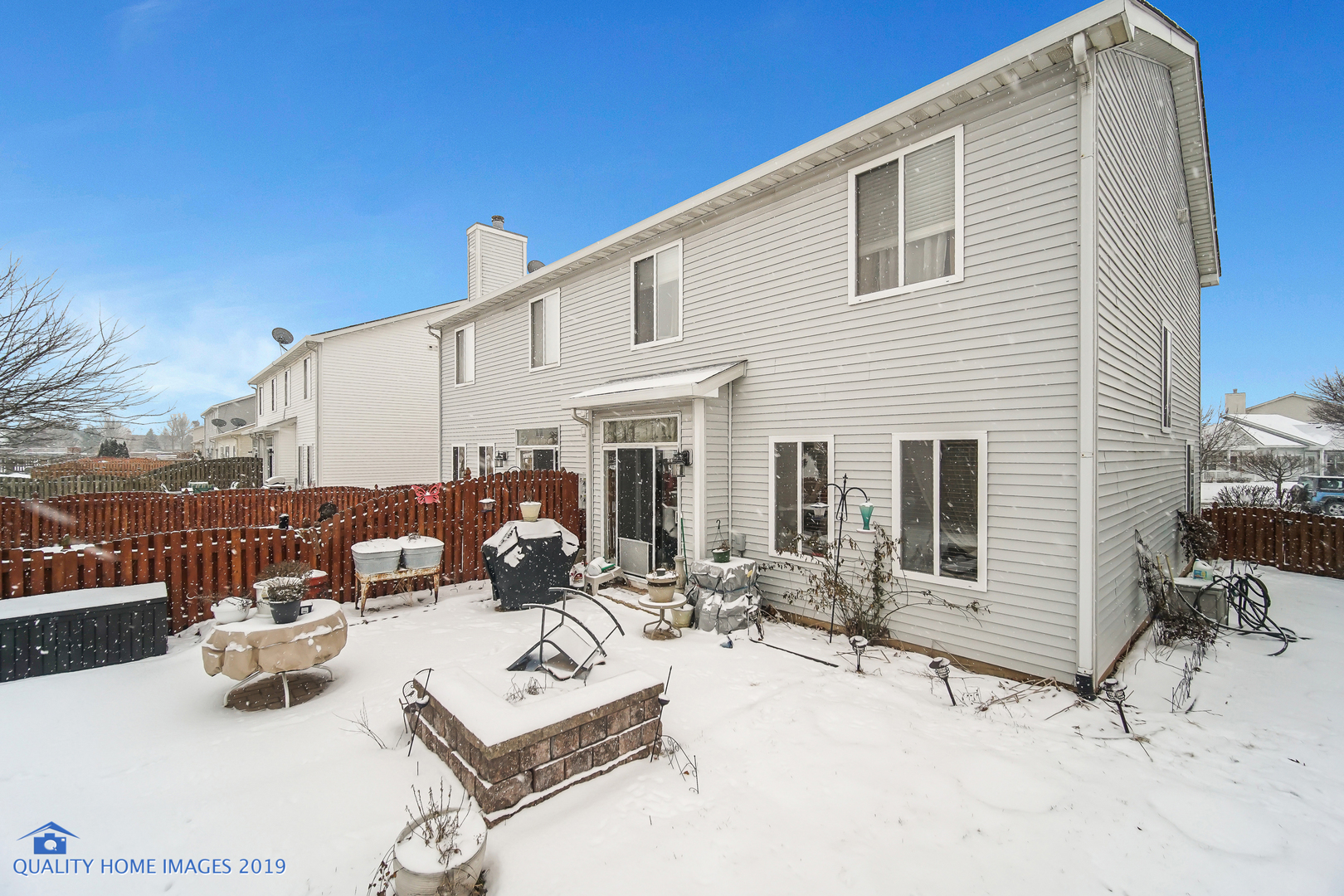 339 Reston Circle Romeoville, IL 60446 - Photo 25 of 26 a view of a patio with couches chairs and potted plants