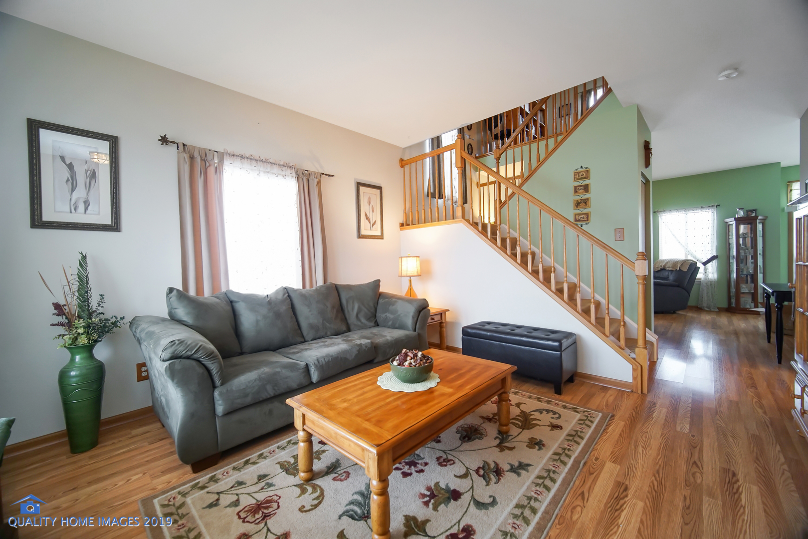 339 Reston Circle Romeoville, IL 60446 - Photo 4 of 26 a living room with furniture and a wooden floor