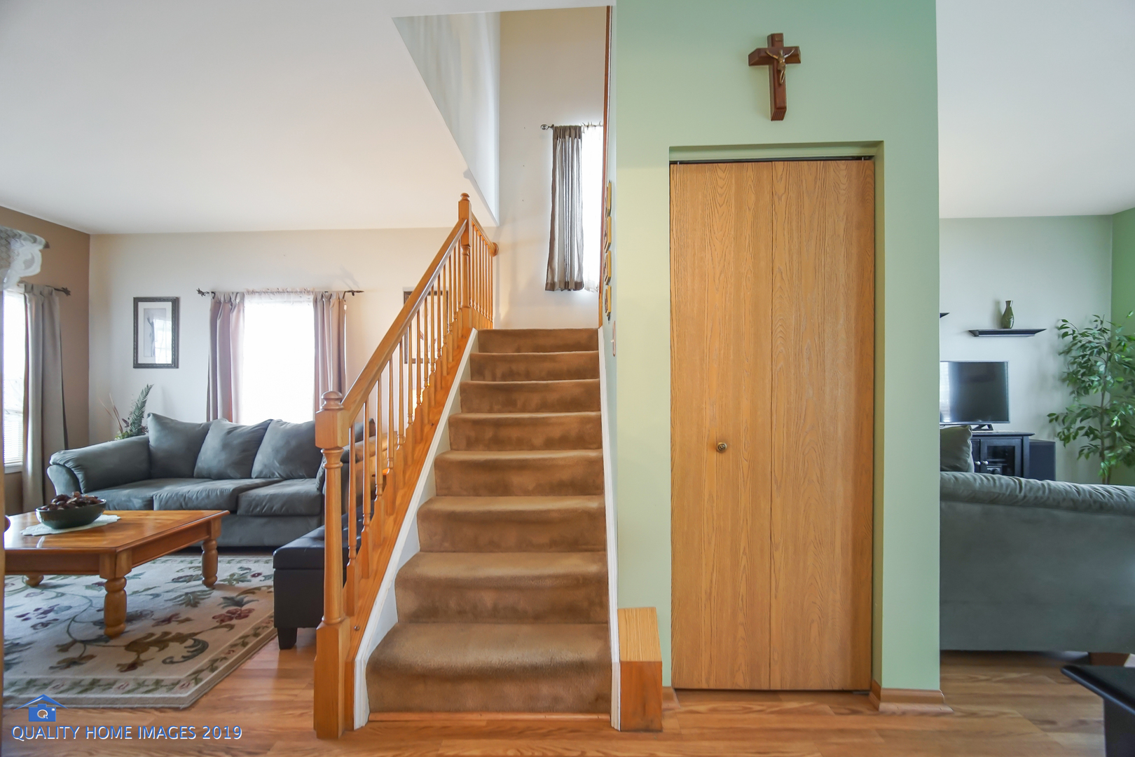 339 Reston Circle Romeoville, IL 60446 - Photo 7 of 26 a view of entryway and hall with wooden floor