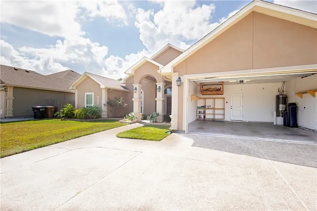 a view of a house with basketball court