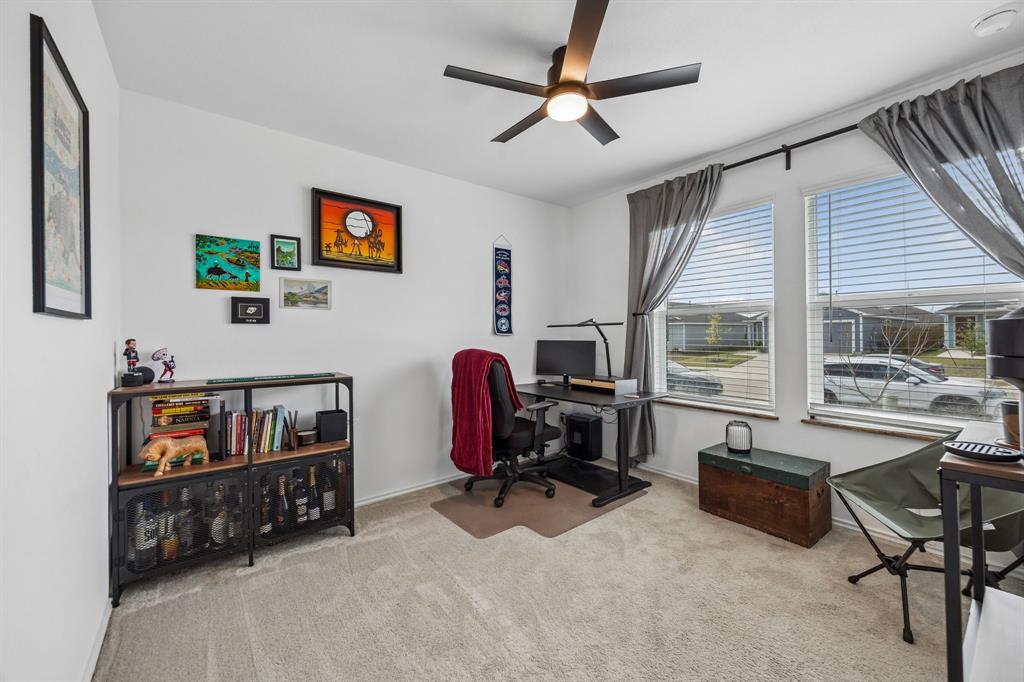 1025 Mountain Laurel Road Princeton, TX 75407 - Photo 15 of 30 a view of a livingroom with workspace and a window