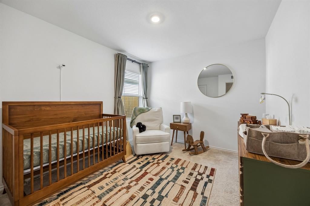 1025 Mountain Laurel Road Princeton, TX 75407 - Photo 16 of 30 a bedroom with furniture and a window