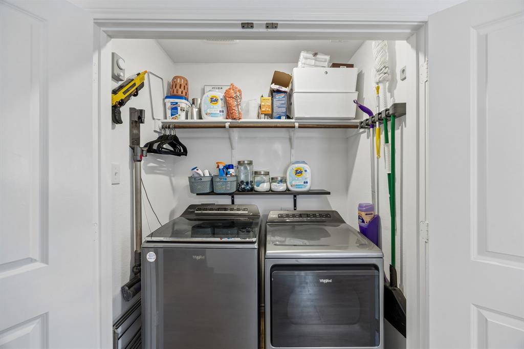 1025 Mountain Laurel Road Princeton, TX 75407 - Photo 19 of 30 a kitchen with a refrigerator and a stove
