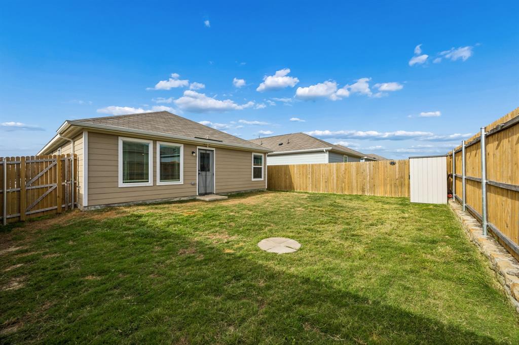 1025 Mountain Laurel Road Princeton, TX 75407 - Photo 24 of 30 a view of a backyard with table and chairs