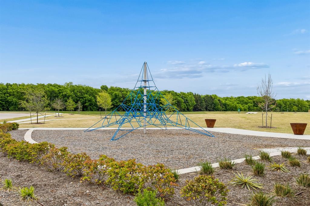 1025 Mountain Laurel Road Princeton, TX 75407 - Photo 27 of 30 a view of a terrace with a bench
