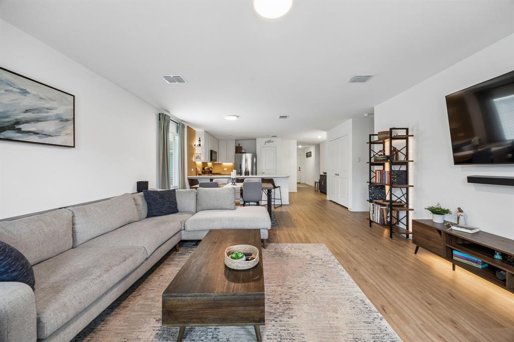 1025 Mountain Laurel Road Princeton, TX 75407 - Photo 8 of 30 a living room with furniture and a flat screen tv