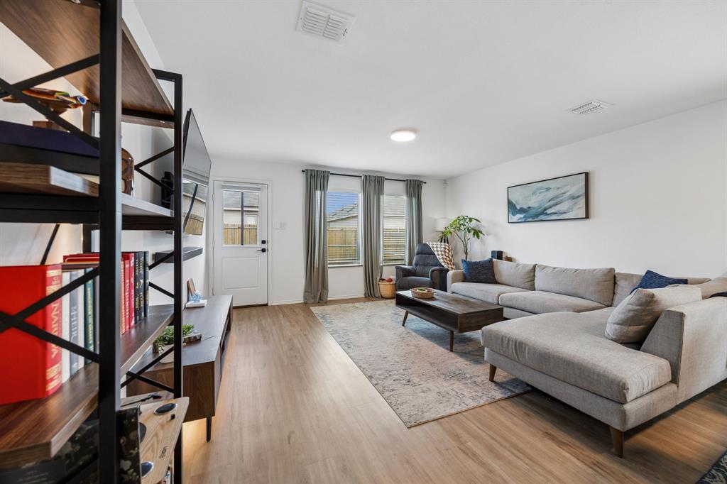 1025 Mountain Laurel Road Princeton, TX 75407 - Photo 9 of 30 a living room with furniture or stairs and a window