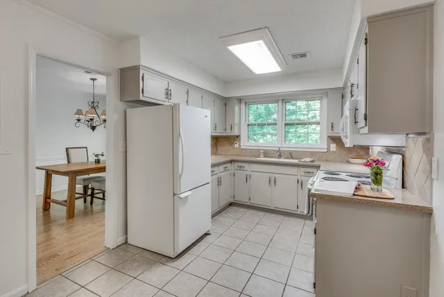 a kitchen with a refrigerator a sink and dishwasher