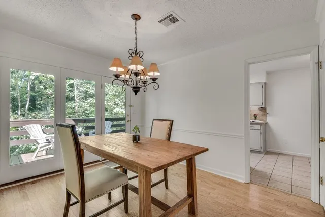 a view of a dining room with furniture window and outside view
