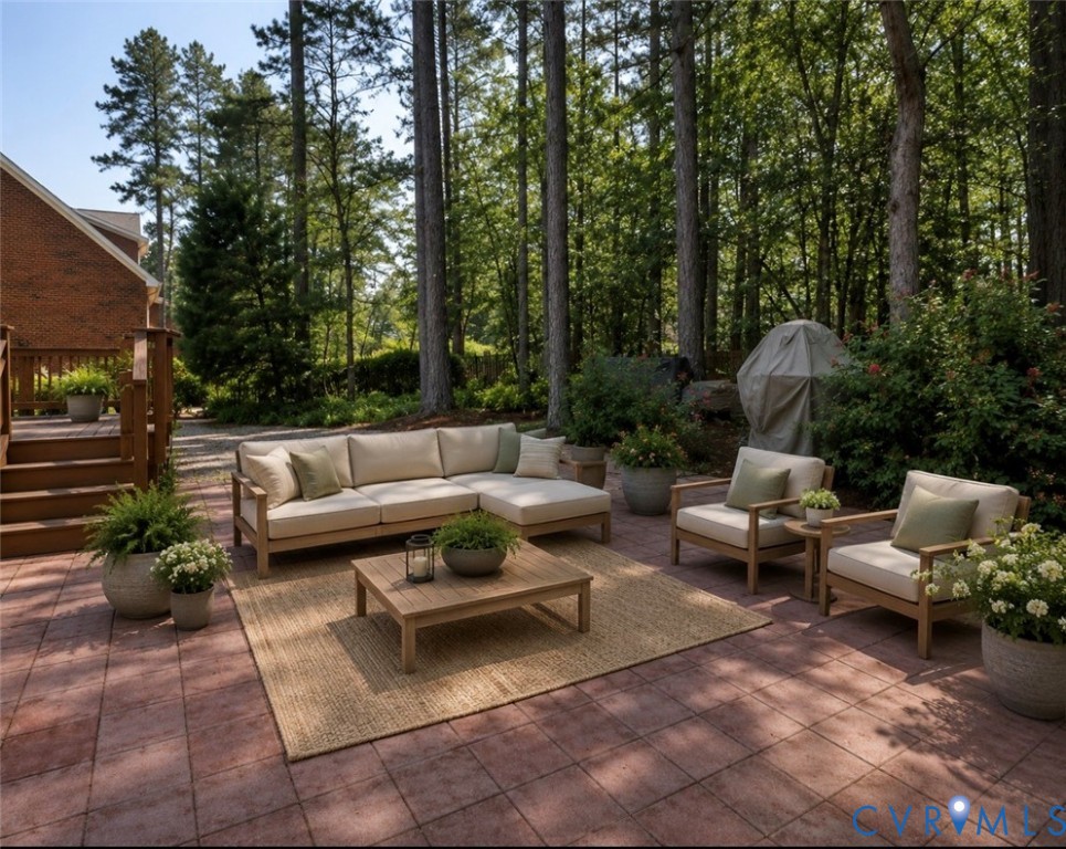 11385 Winding River Road Providence Forge, VA 23140 - Photo 5 of 43 a view of a patio with couches and a fire pit and a yard