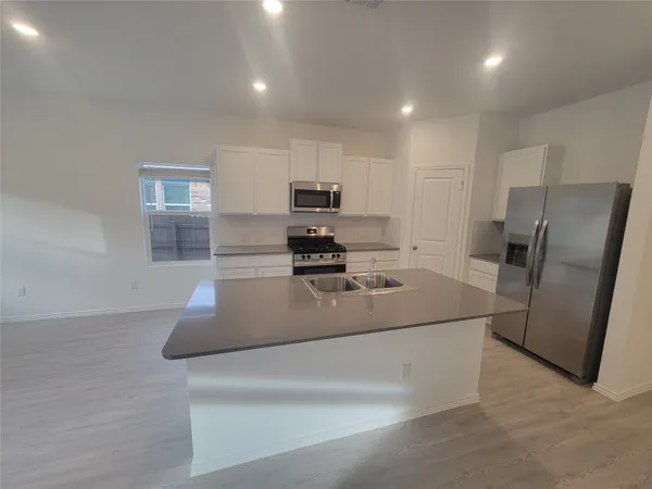 a view of kitchen with wooden floor