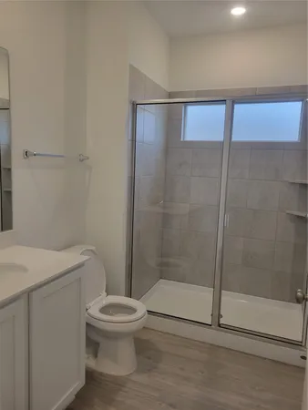 a bathroom with a bathtub and shower
