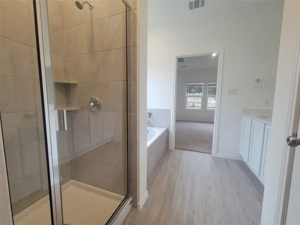 a bathroom with a bathtub and a sink