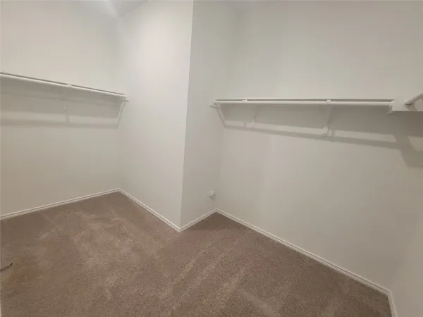 a view of a room with a bench and cabinet