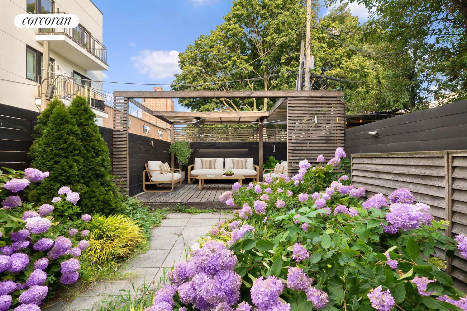 139 Rochester Avenue Brooklyn, NY 11213 - Photo 11 of 17 a view of a patio with a lot of flower plants