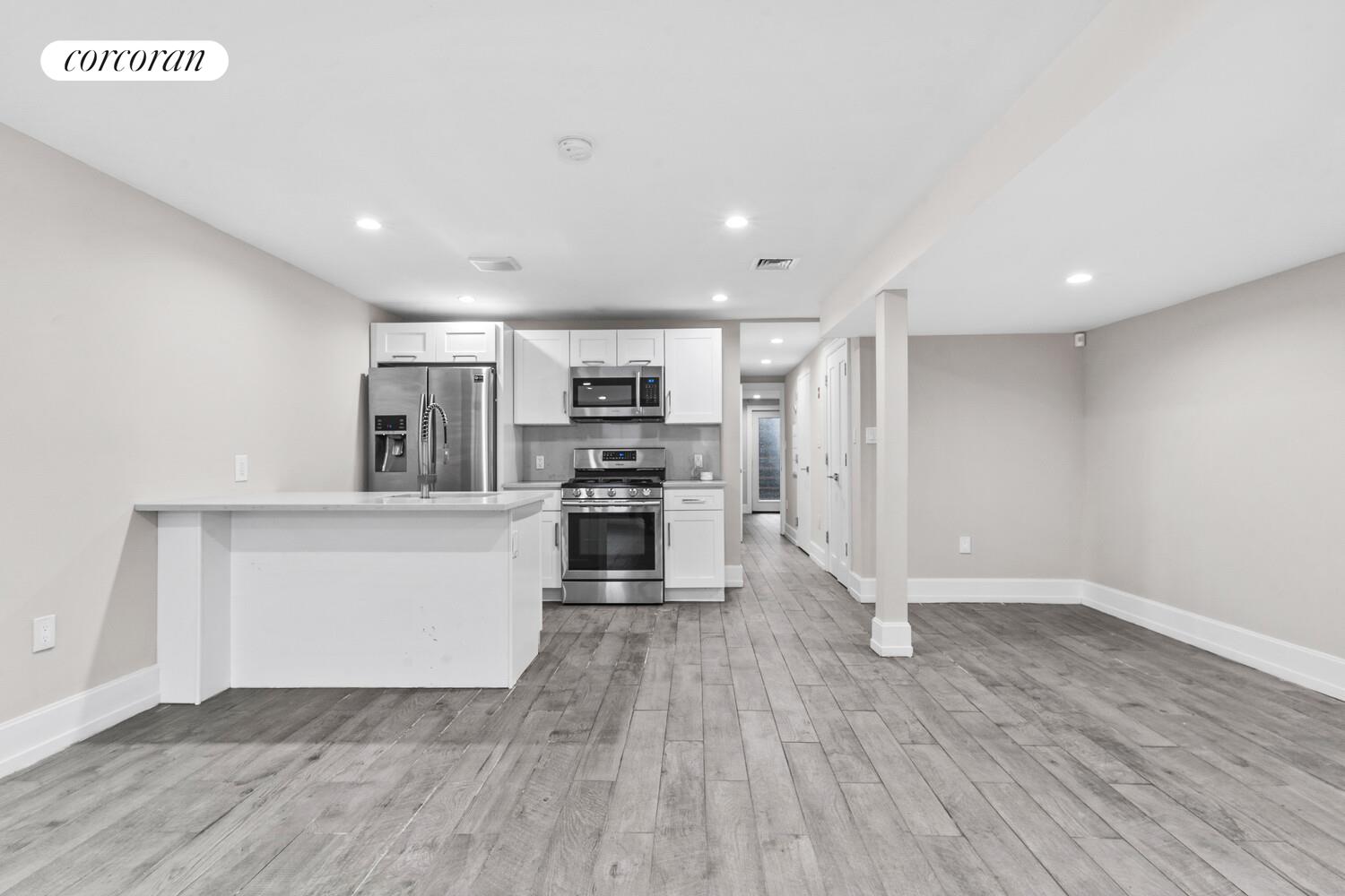 139 Rochester Avenue Brooklyn, NY 11213 - Photo 13 of 17 a kitchen with stainless steel appliances a refrigerator and a stove top oven