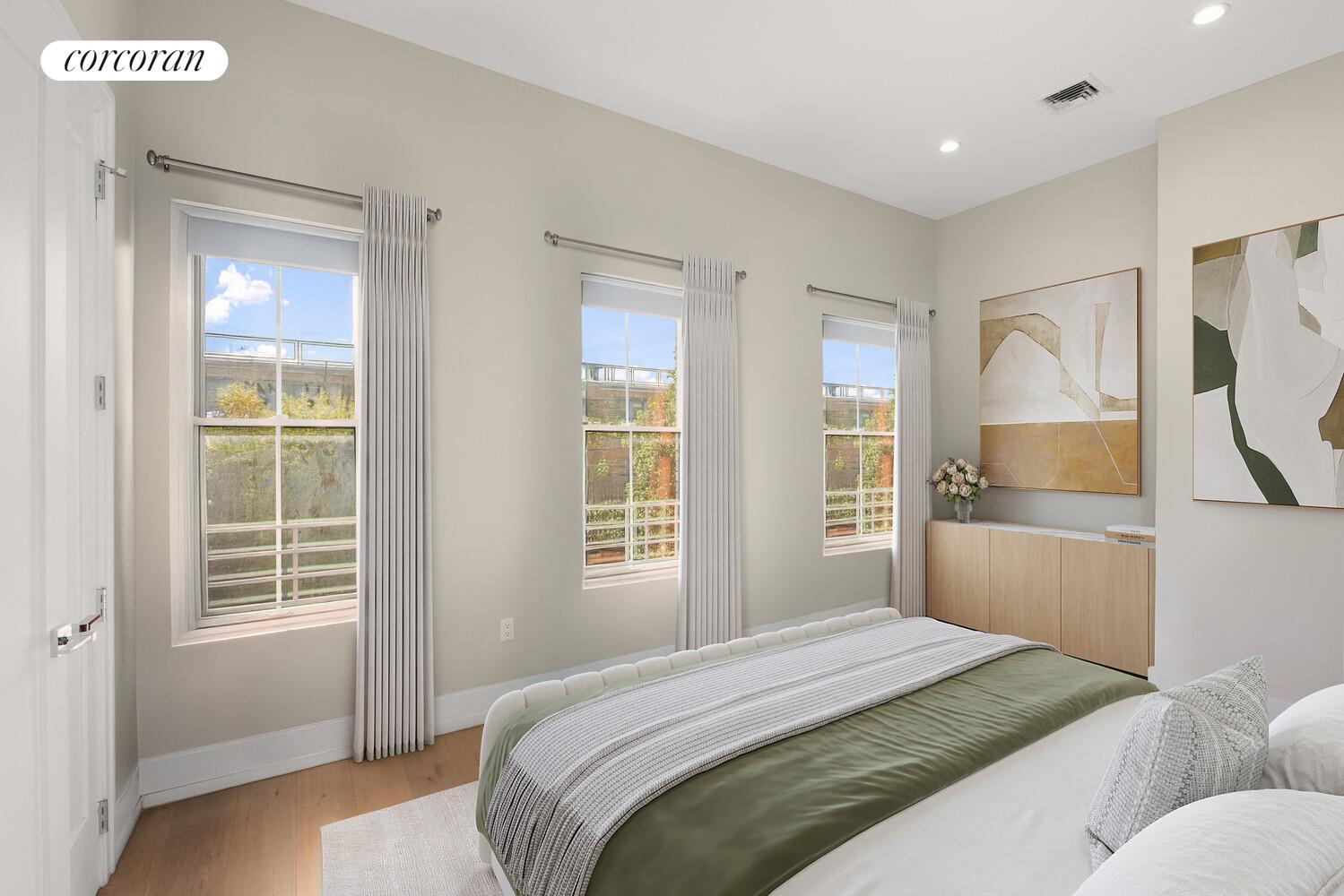 139 Rochester Avenue Brooklyn, NY 11213 - Photo 5 of 17 a bedroom with a bed and a window