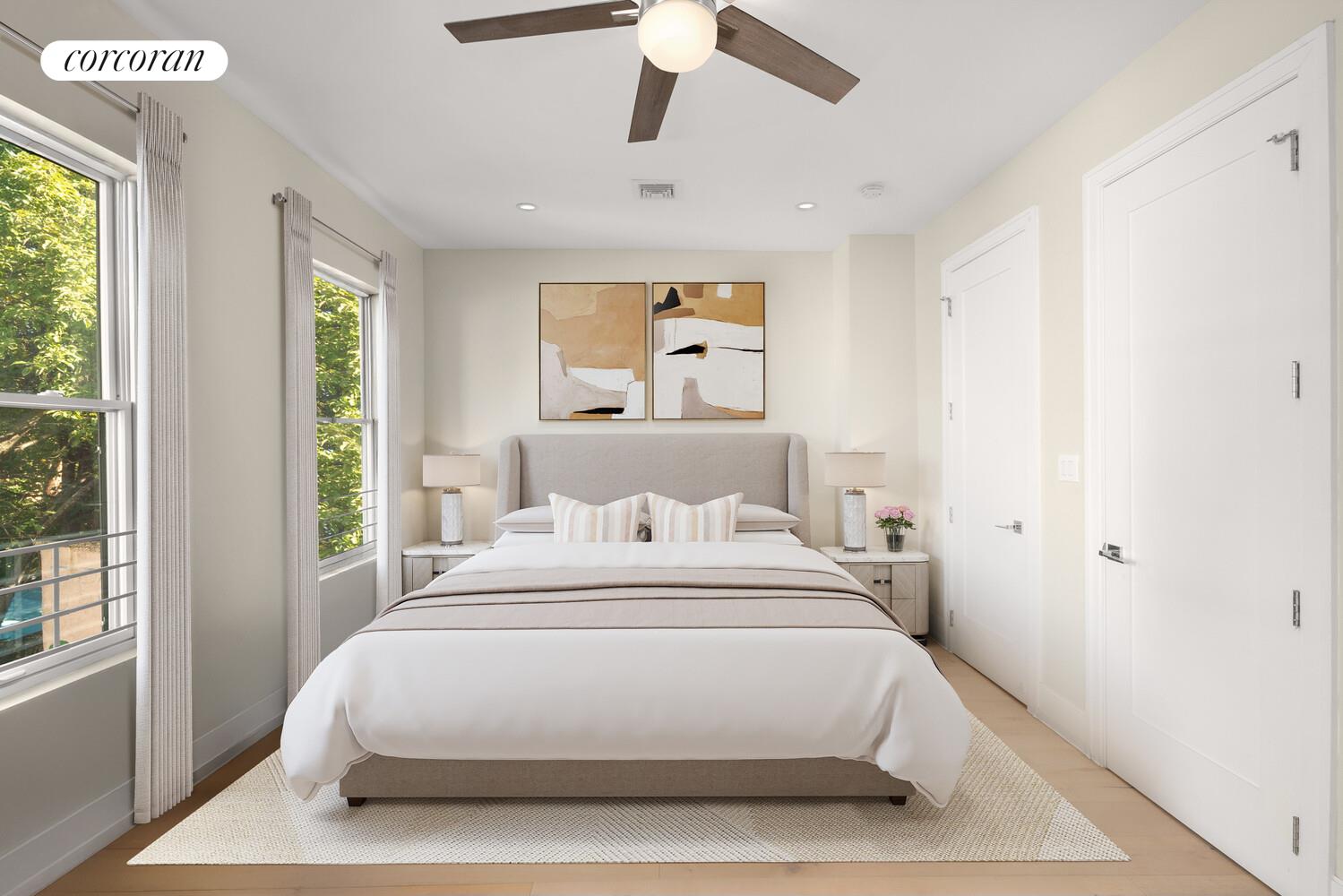 139 Rochester Avenue Brooklyn, NY 11213 - Photo 6 of 17 a large white bed in a white room next to a window