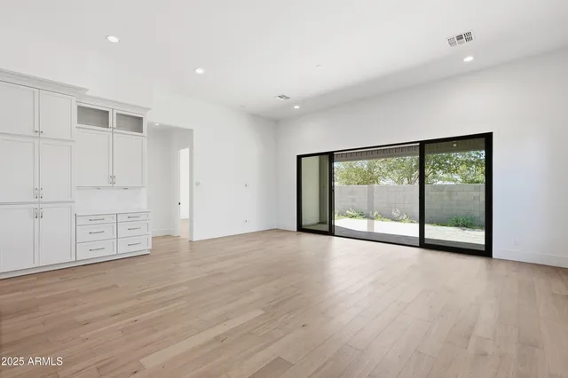 a spacious bathroom with double vanity sink and a large mirror