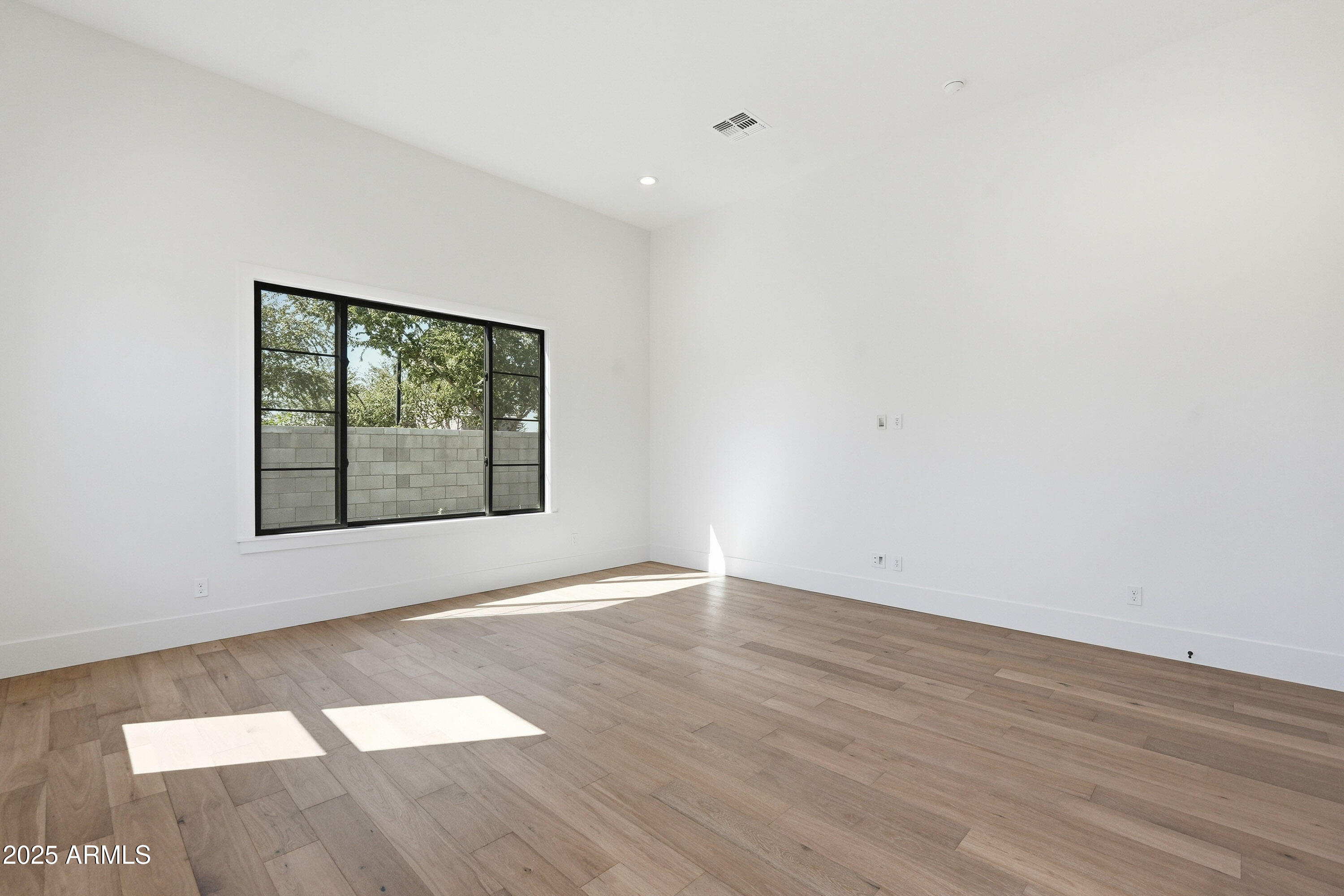 3326 South Stuart Court Gilbert, AZ 85297 - Photo 26 of 88 an empty room with wooden floor and windows