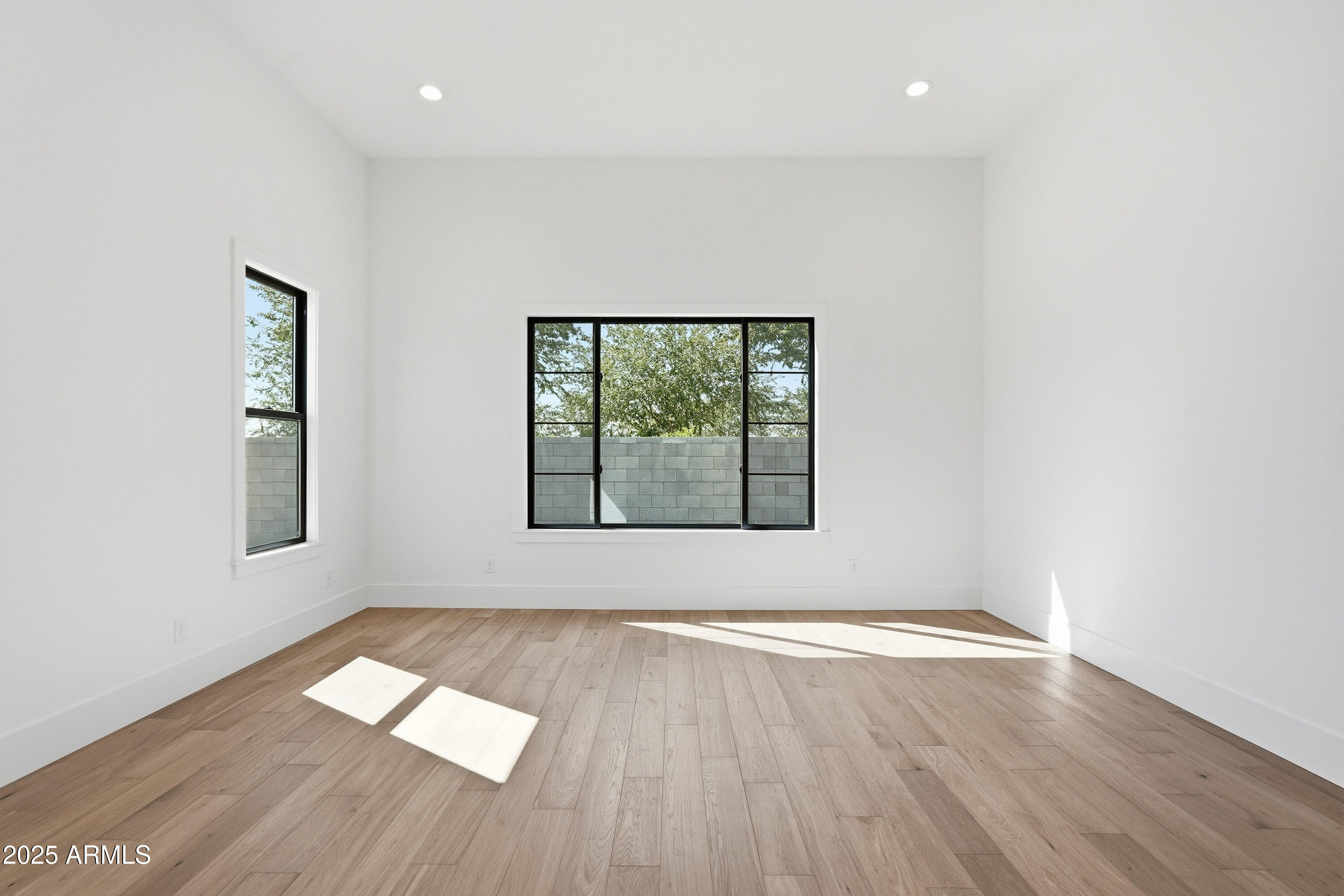 3326 South Stuart Court Gilbert, AZ 85297 - Photo 28 of 88 an empty room with wooden floor and windows
